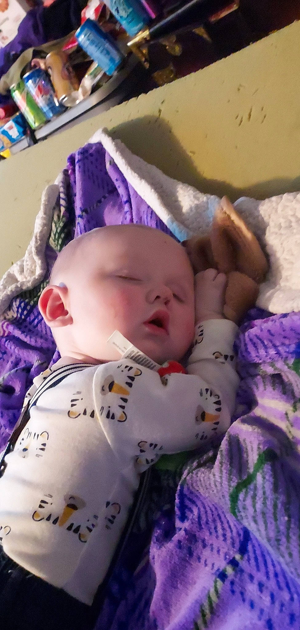 George joined the competition — help win amazing prizes! baby, baby_products, baby_sleeping, baby_toddler_clothing, bedtime, cheek, child, comfort, eye, face, head, linens, mammal, nap, pattern, person, purple, shelf, skin, textile