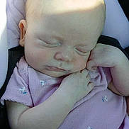 Alex joined the competition — help win amazing prizes! baby, sleeping, infant, onesie, purple_clothing, cushion, seat, child, peaceful, soft_light, shadow, small_flower_pattern, cute, resting, portrait, skin, hand, head, closed_eyes, indoor