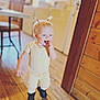Annabelle joined the competition — help win amazing prizes! toddler, child, indoor, wooden_floor, wooden_wall, boots, yellow_shirt, patterned_pants, two_ponytails, walking, happy, curious, person, floor, furniture, chair, daylight, home, cute, smiling
