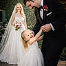 bride, celebration, child, dance, dress, family, flower_bouquet, formal_clothing, girl, groom, happy, love, man, nature, outdoor, smile, tuxedo, veil, wedding, woman