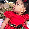 Giafripp is registered to the contest to win money with this photo: child, toddler, red_dress, bow, curly_hair, outdoor, grass, side_profile, winter, car, house, sky, face, portrait, cute, young_child, fashion, holiday, expression, nature