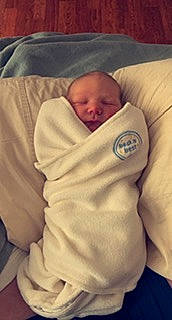 King is registered to the contest to win money with this photo: baby, baby_products, baby_safety, baby_sleeping, baby_toddler_clothing, bedding, bedtime, cheek, child, comfort, linens, mouth, nap, person, product, room, skin, sleep, sleeve, thumb