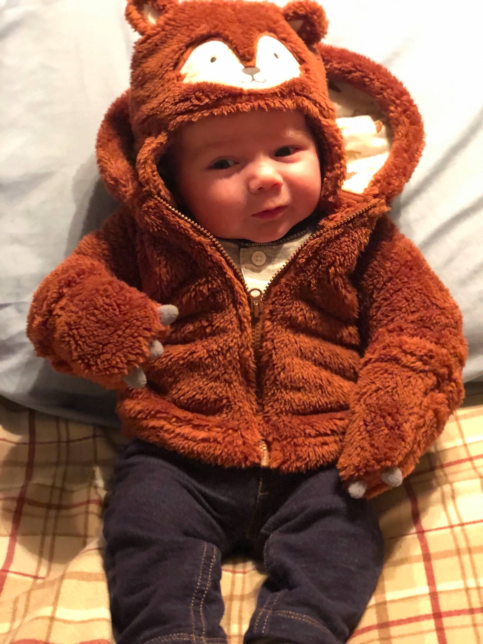 Connor is registered to the contest to win money with this photo: brown, child, ear, fur, headwear, hood, outerwear, person, stuffed_toy, toddler, toy, wool
