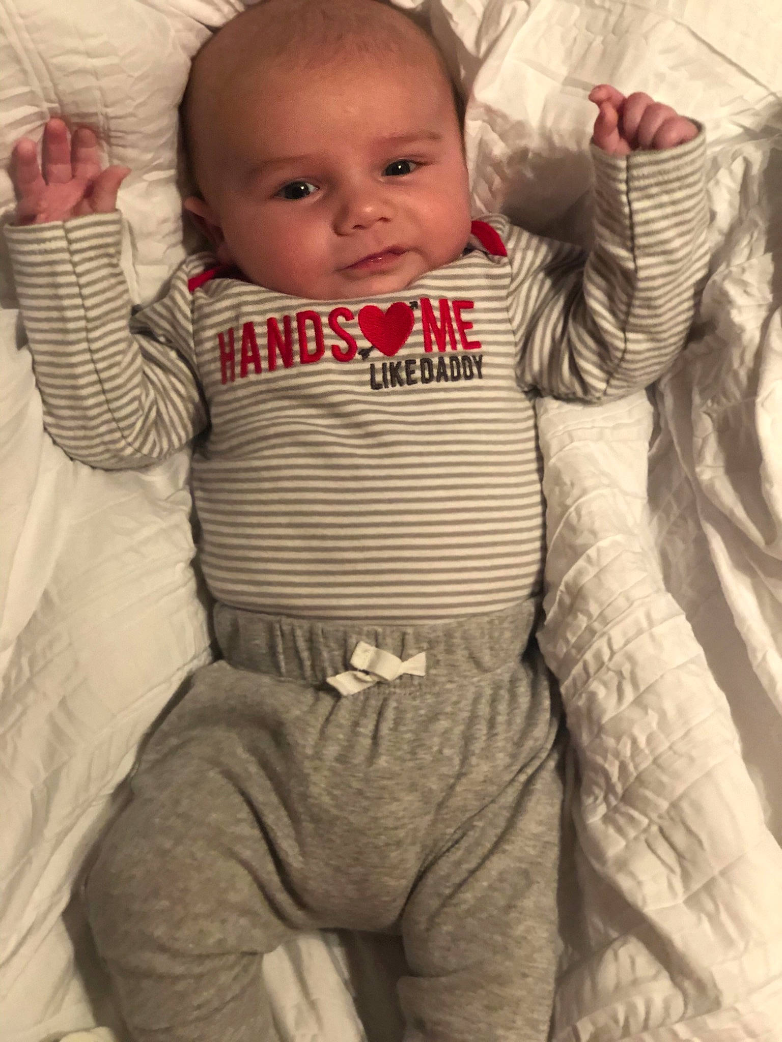 Connor is registered to the contest to win money with this photo: baby, baby_products, baby_toddler_clothing, cheek, child, eye, head, person, product, skin, sleeve, smile, toddler