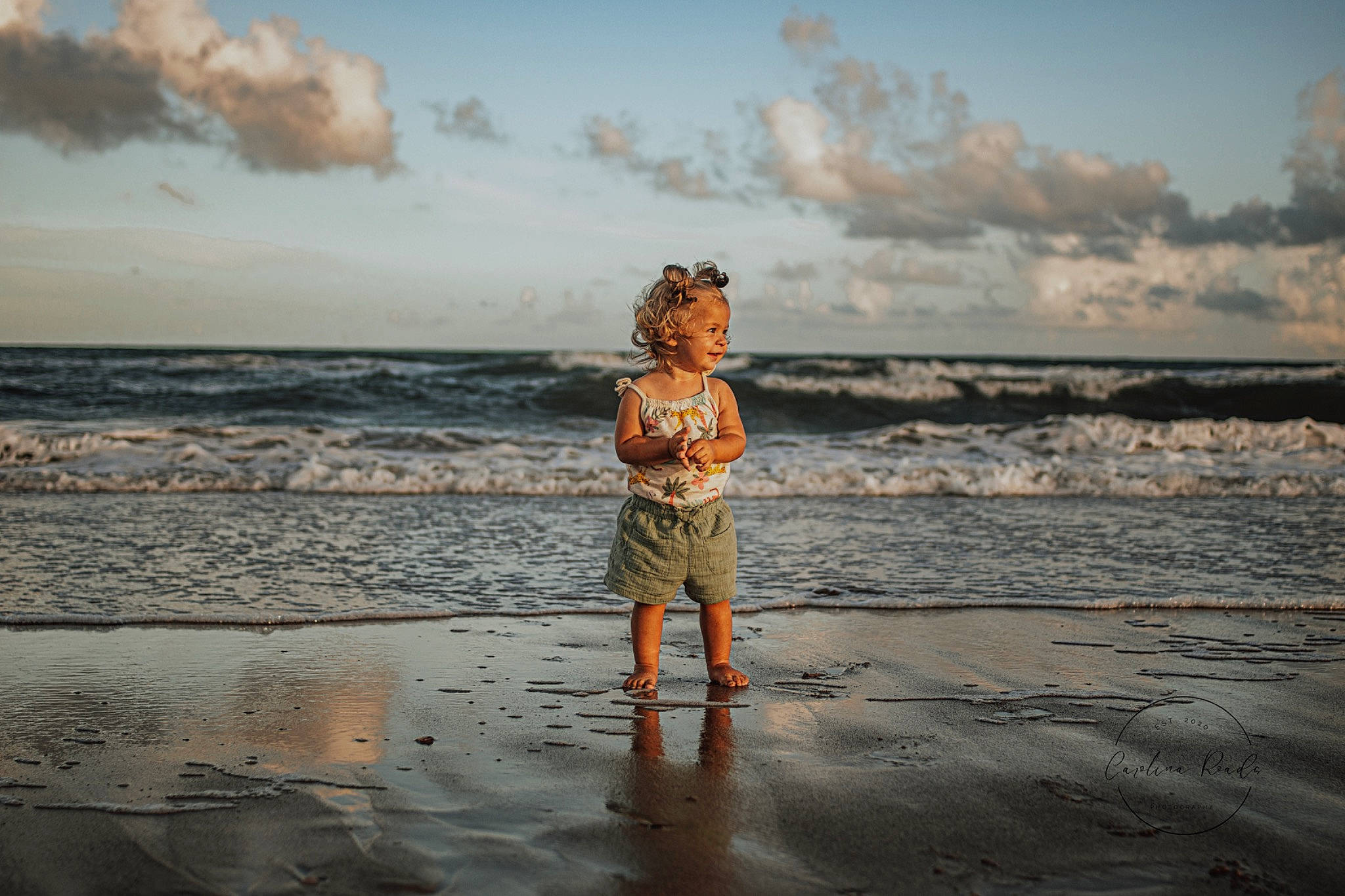 Sophie is registered to the contest to win money with this photo: beach, calm, cloud, coastal_and_oceanic_landforms, cumulus, flash_photography, fun, happy, horizon, landscape, leisure, people_in_nature, people_on_beach, person, shore, sky, sunlight, toddler, water, wind_wave