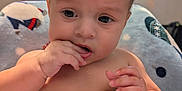 Isaac is registered to the contest to win money with this photo: baby, blanket, child, clothing, cozy, curious, cute, diaper, expression, face, fingers, hair, hand, home, indoors, infant, portrait, sitting, skin, television