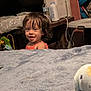 Naomi joined the competition — help win amazing prizes! background, blanket, bottle, child, childhood, container, curly_hair, face, furniture, hair, happy, indoor, person, plastic, room, smiling, table, toddler, toy, wood