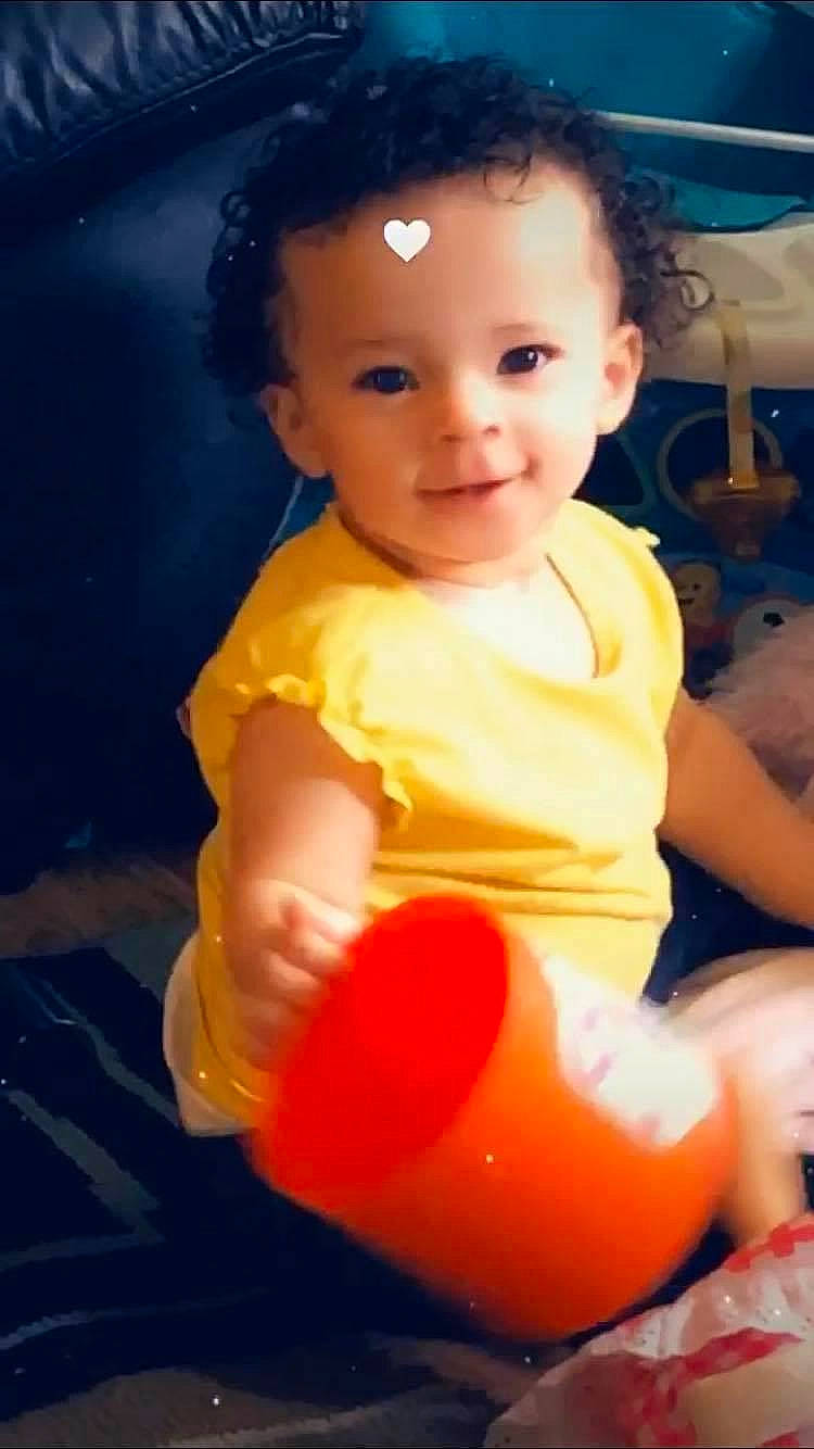 Araeleigh is registered to the contest to win money with this photo: baby, baby_toddler_clothing, blue, cheek, child, eye, flash_photography, fun, hair, hairstyle, happy, head, human_body, joy, mouth, person, shorts, sitting, skin, smile