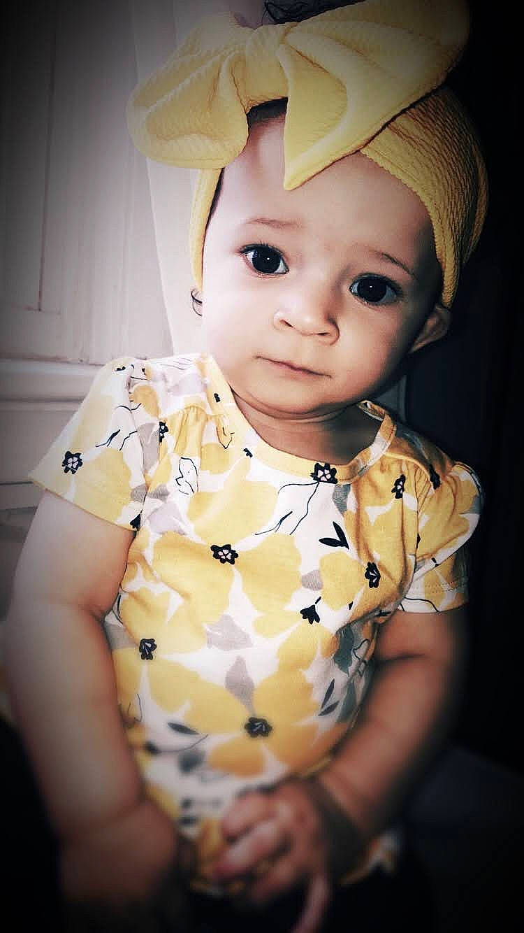 Araeleigh joined the competition — help win amazing prizes! baby, cap, cheek, chin, dress, eyelash, flash_photography, hair, hand, head, headgear, helmet, human_body, lip, neck, nose, person, skin, sleeve, toddler