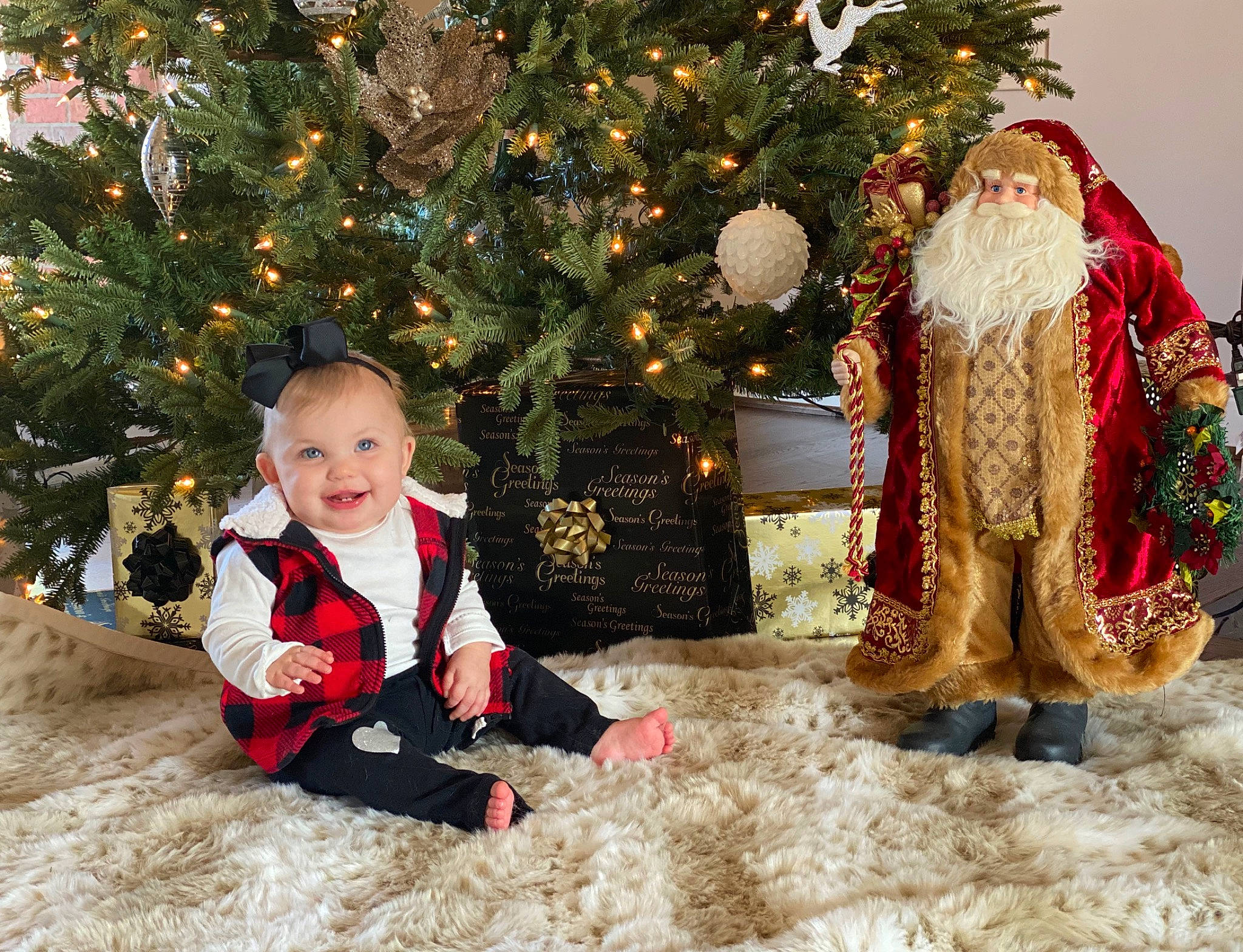 Mckinley is registered to the contest to win money with this photo: child, christmas, christmas_decoration, christmas_eve, christmas_ornament, christmas_tree, conifer, event, fictional_character, fir, holiday, interior_design, joy, outerwear, person, plant, santa_claus, sitting, toddler, tradition