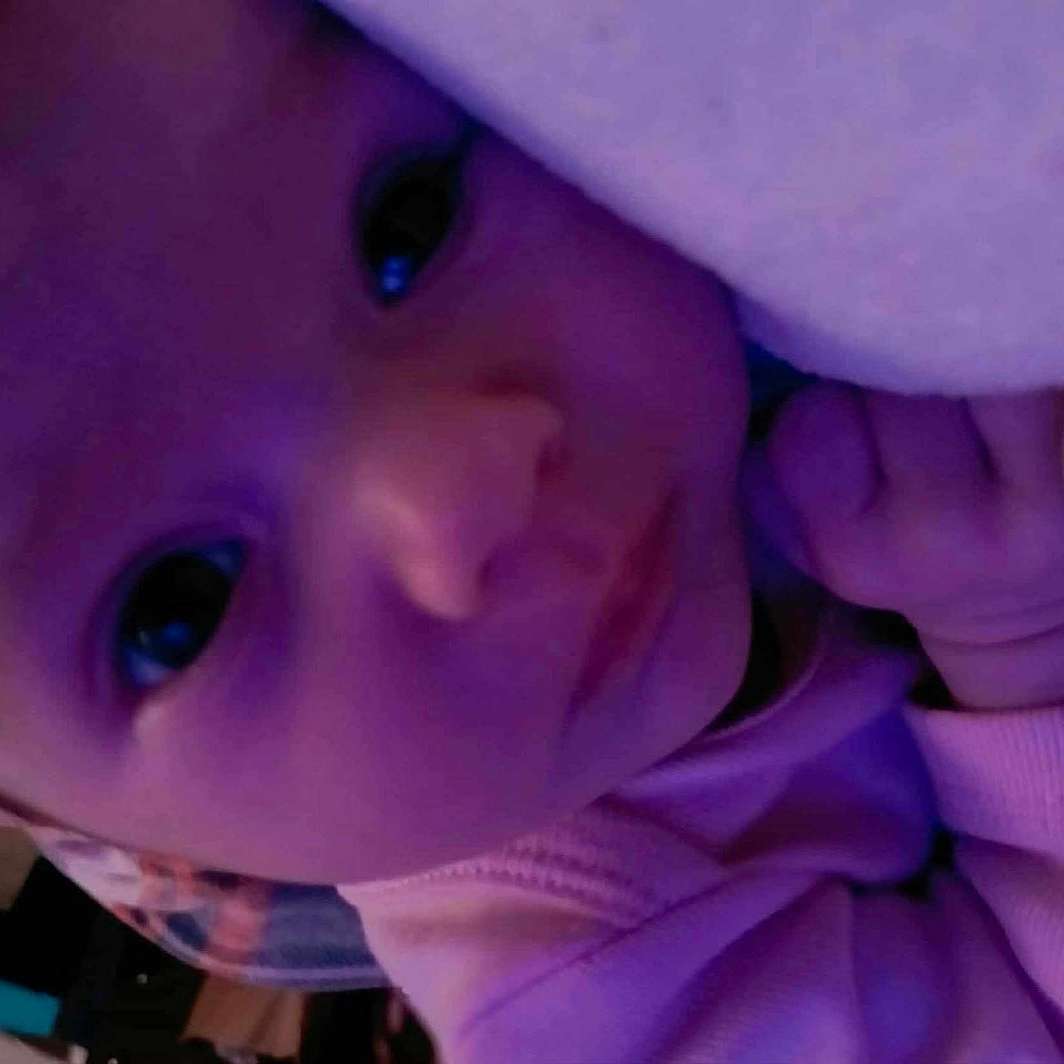 Lyvia joined the competition — help win amazing prizes! baby, blanket, child, close_up, cozy, cute, expression, eyes, face, hand, head, indoors, infant, portrait, purple_light, skin, sleepy, soft, wearing_clothes, young