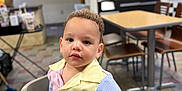Simon joined the competition — help win amazing prizes! casual_clothing, chair, child, curious_expression, curly_hair, dining_area, face, floor_tiles, high_chair, indoor, light_skin, person, portrait, restaurant, seated, short_sleeves, striped_shirt, table, toddler, young_child