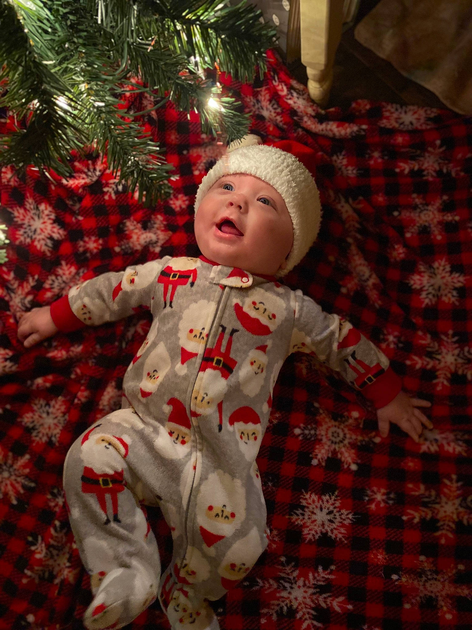 Izaiah is registered to the contest to win money with this photo: baby_toddler_clothing, carmine, christmas, christmas_decoration, christmas_eve, christmas_ornament, christmas_tree, conifer, event, happy, headwear, holiday, holiday_ornament, ornament, pattern, person, plaid, plant, red, sleeve