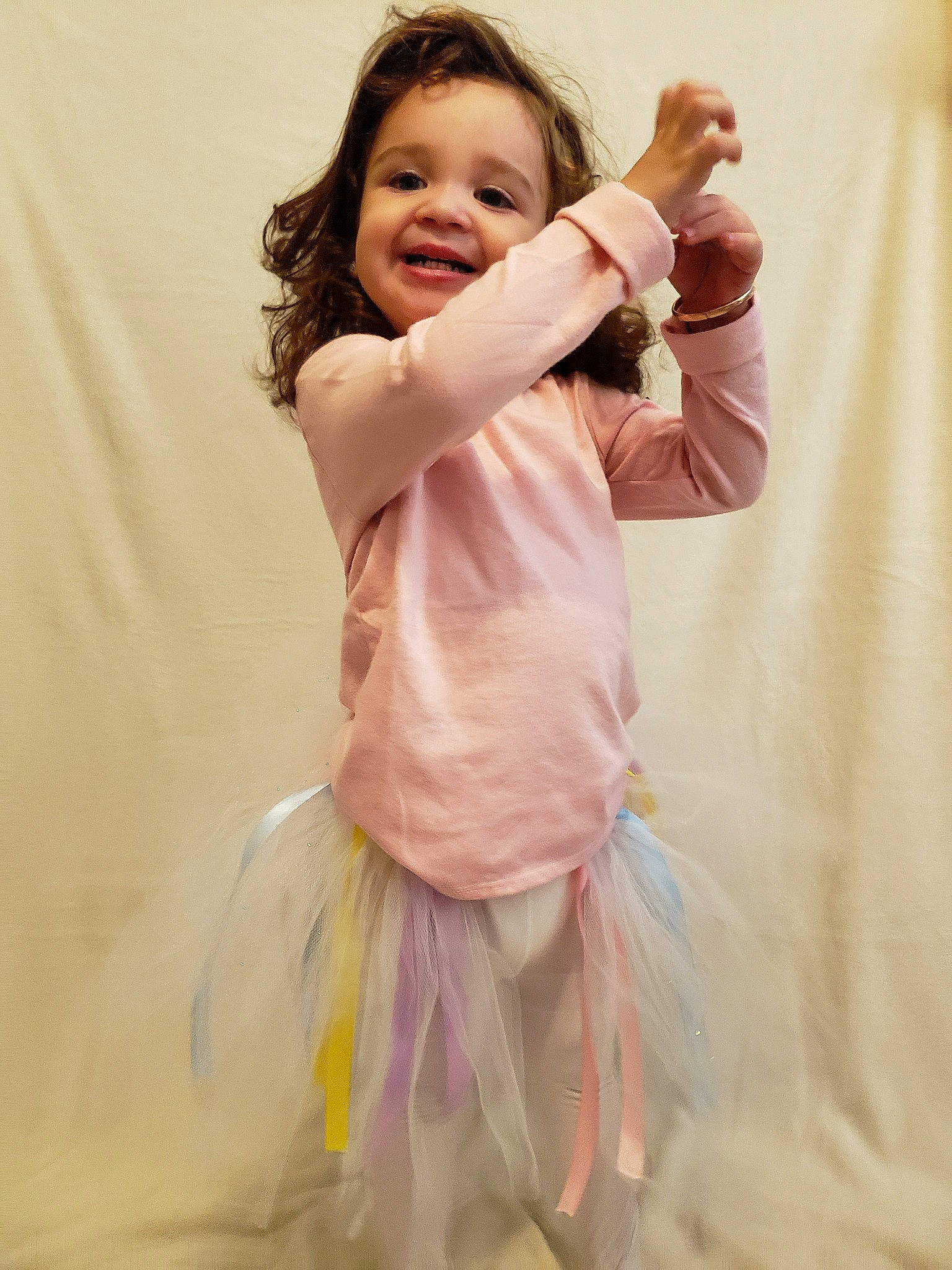 Cataleya is registered to the contest to win money with this photo: arm, baby, ballet_tutu, child, child_model, costume, finger, gesture, hand, happy, joy, person, pink, skin, sleeve, smile, toddler