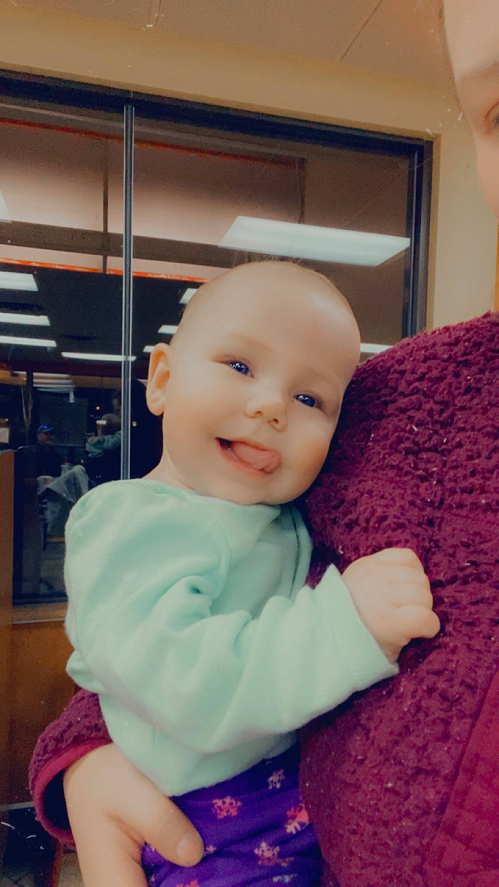 Alita is registered to the contest to win money with this photo: abdomen, baby, baby_toddler_clothing, cheek, child, comfort, fun, happy, iris, joy, linens, magenta, pattern, person, pink, purple, room, sitting, sleeve, smile