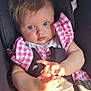 baby, child, infant, car_seat, pink_dress, checkered_pattern, blue_eyes, hands, sunlight, rosy_cheeks, cute, portrait, seated, clothing, straps, safety_harness, indoor, closeup, skin, expression