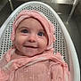 baby, infant, smile, pink_cloth, bath, white_bath_seat, sink, water, blue_eyes, wrapped, happy, cute, child, face, indoor, towel, kitchen_sink, person, head_covering, closeup