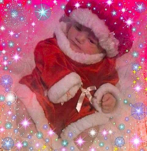 Nevaeh is registered to the contest to win money with this photo: christmas, christmas_decoration, christmas_ornament, computer_wallpaper, event, fictional_character, holiday, person, pink, santa_claus, space