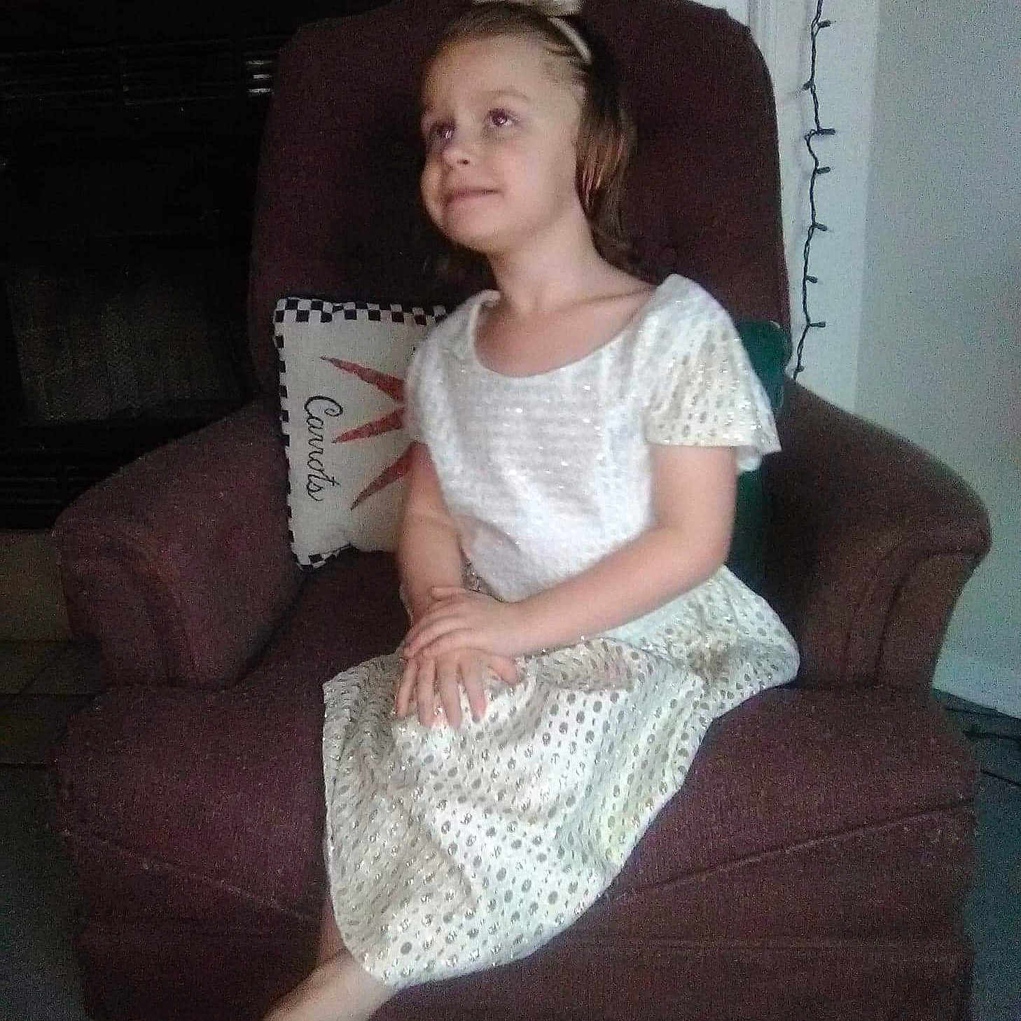 Erica is registered to the contest to win money with this photo: dress, girl, joint, lace, lady, leg, person, shoulder, sitting, textile, thigh, trunk
