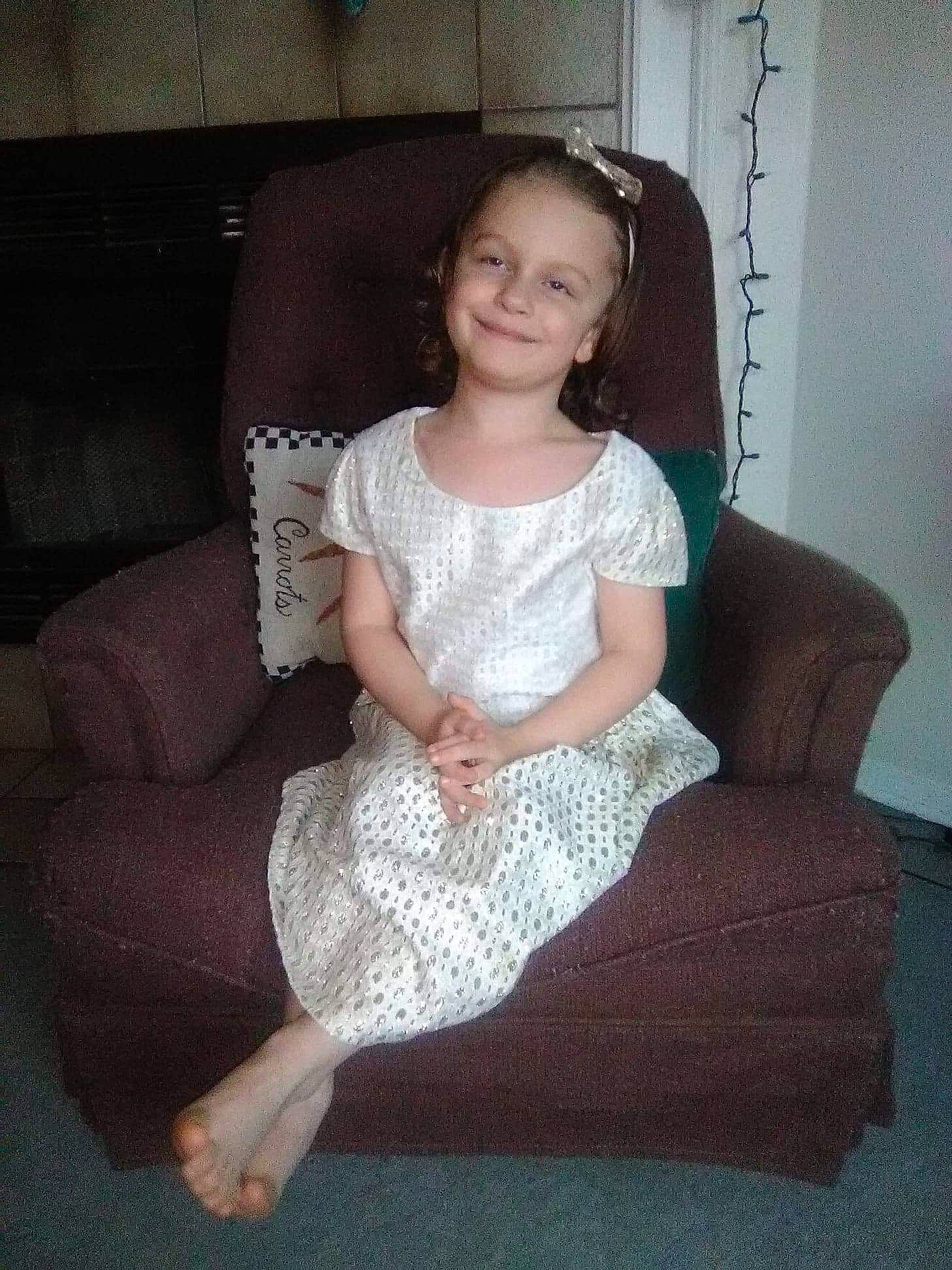 Erica joined the competition — help win amazing prizes! beauty, child, day, dress, fun, girl, human_hair_color, iris, joint, joy, lady, leg, pattern, person, product, shoulder, sitting, smile, standing, textile