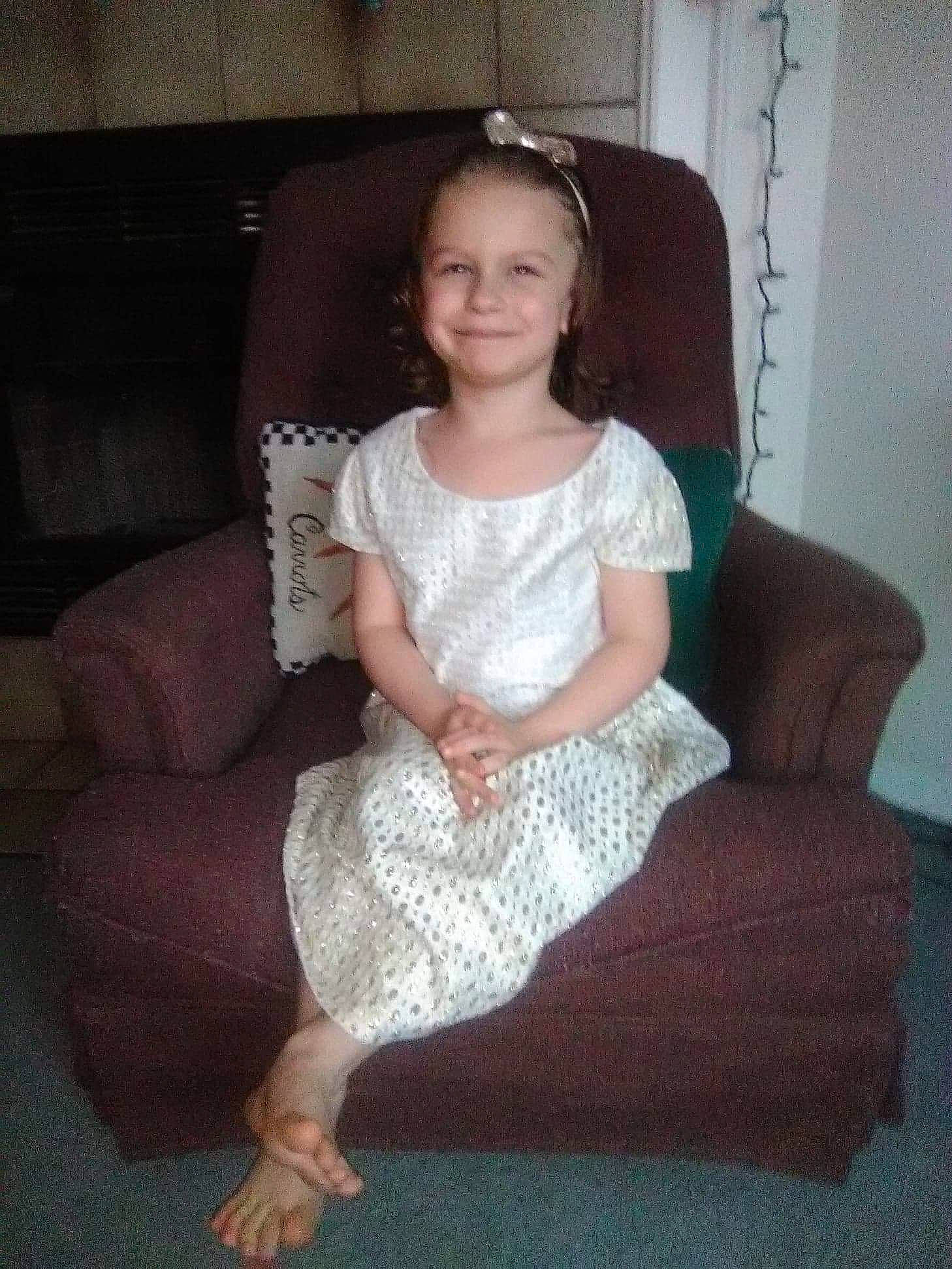 Erica joined the competition — help win amazing prizes! bridal_clothing, child, dress, fashion_accessory, fun, girl, gown, joy, lady, leg, person, sitting, textile, toddler, trunk, wedding_dress