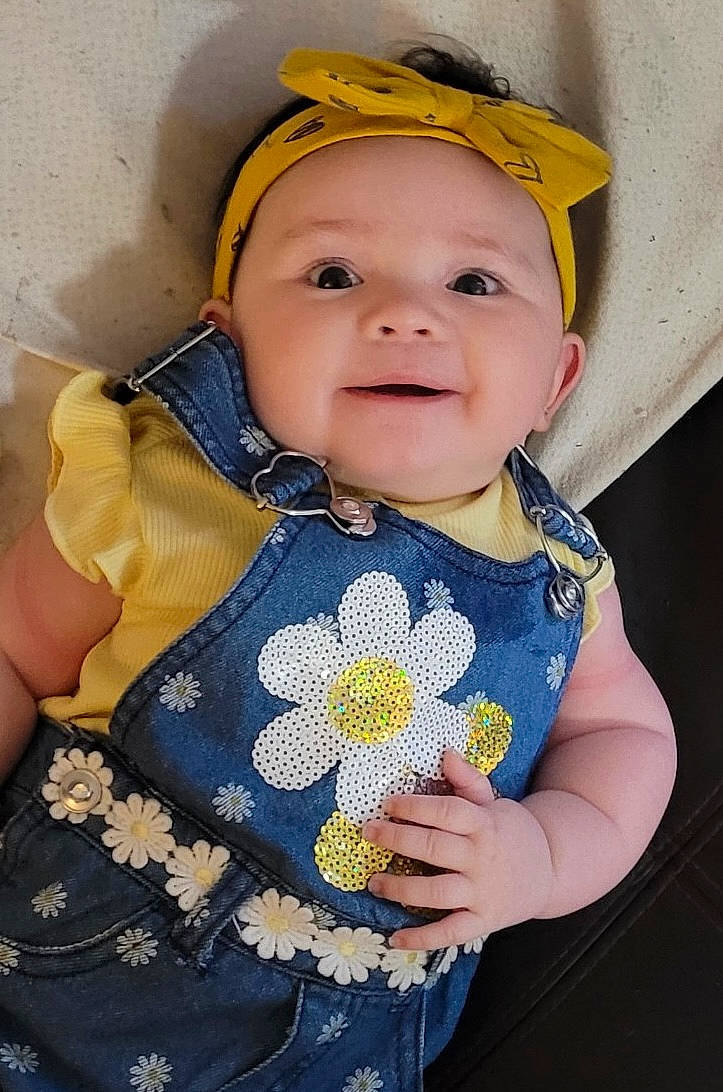 Kaliyah Elena Hampton joined the competition — help win amazing prizes! baby, baby_products, baby_toddler_clothing, cheek, child, eye, face, facial_expression, flower, happy, headgear, headwear, iris, lip, pattern, person, skin, sleeve, smile, t_shirt
