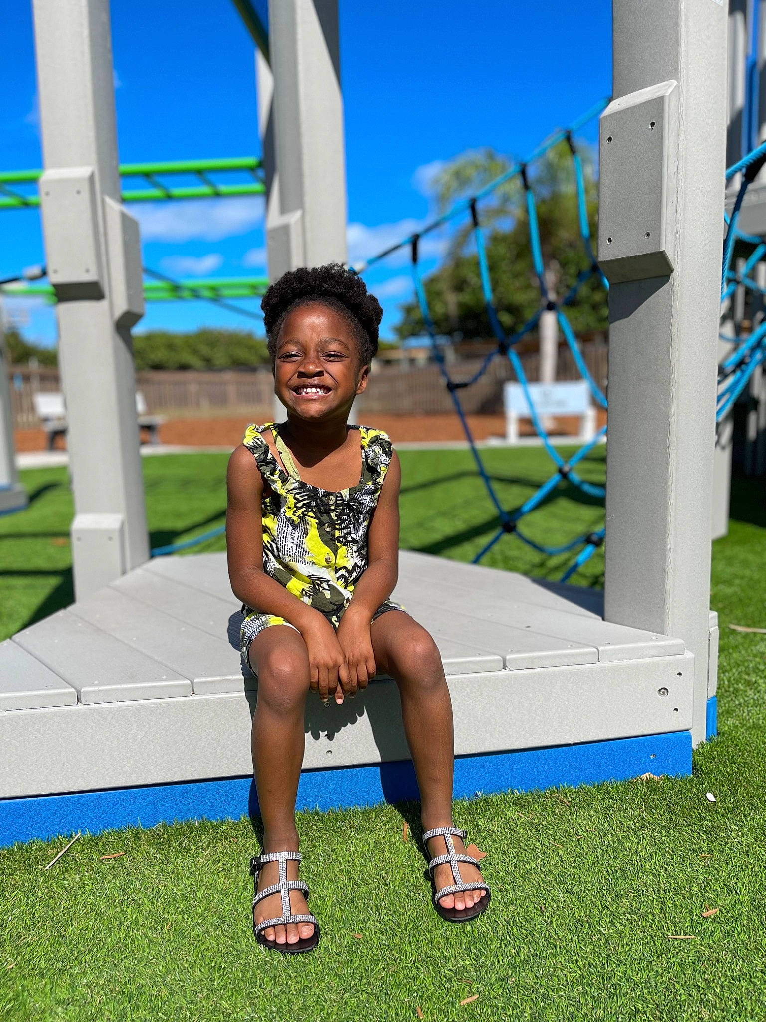 Cyan joined the competition — help win amazing prizes! child, city, competition_event, electric_blue, event, fun, grass, happy, human_leg, joy, leisure, person, play, recreation, sandal, sitting, sky, slipper, toddler, tourism