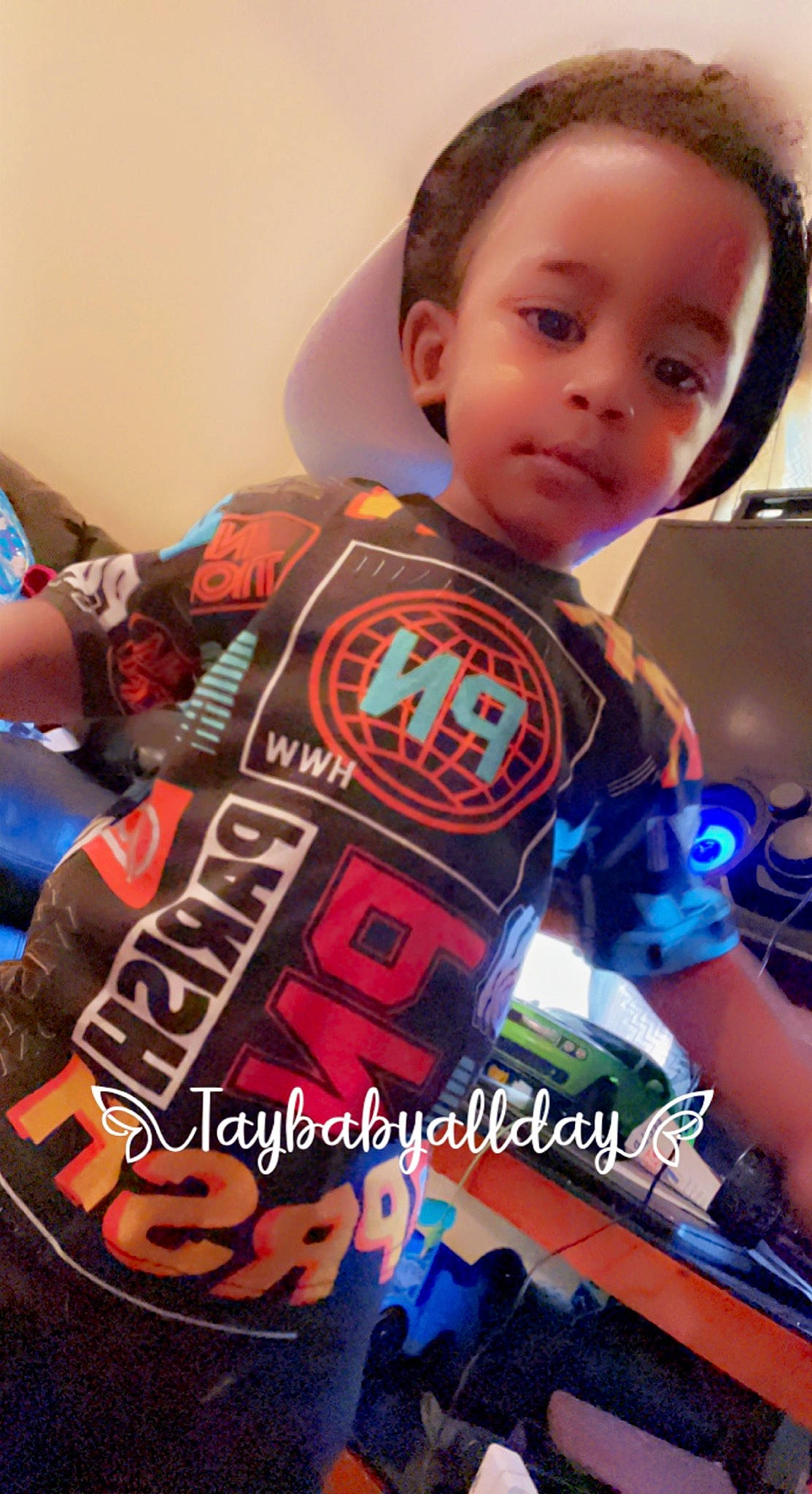 Dakari joined the competition — help win amazing prizes! audio_equipment, child, electric_blue, electronic_instrument, entertainment, fictional_character, font, fun, games, jersey, logo, pattern, person, personal_protective_equipment, play, recreation, selfie, sleeve, t_shirt, toddler