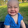 baby, child, smiling, outdoor, grass, blue_shirt, happy, cute, sitting, sunlight, greenery, palm_trees, portrait, infant, face, skin, nature, summer, cheerful, playful