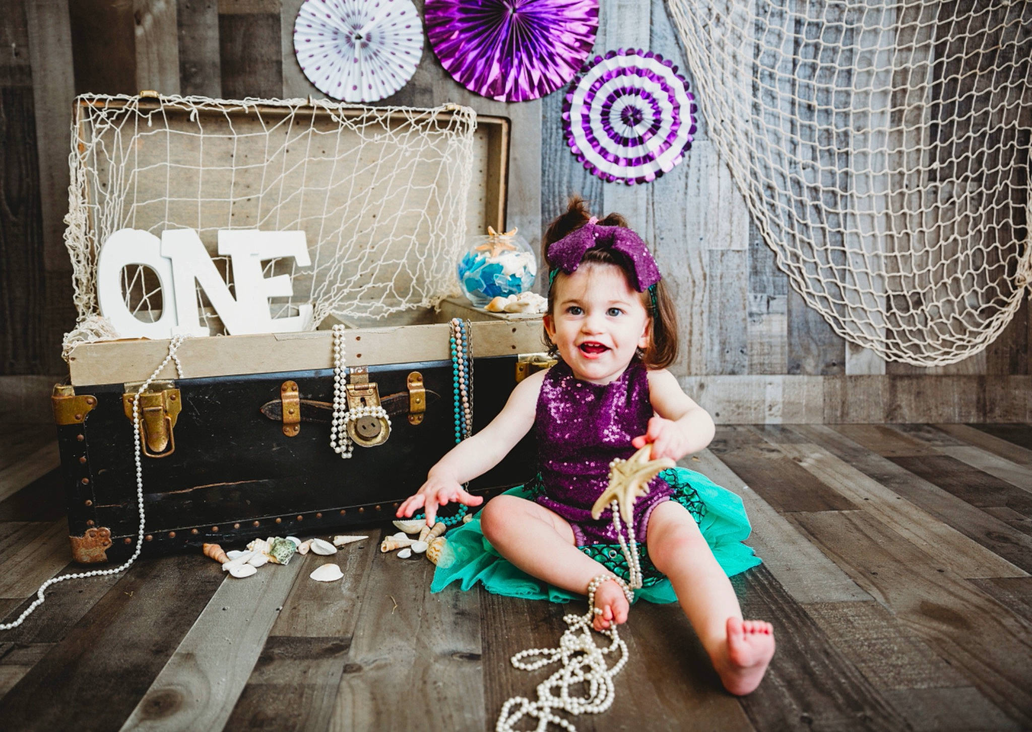 Esmae is registered to the contest to win money with this photo: design, event, fashion_accessory, fashion_design, flash_photography, flooring, happy, lighting, magenta, pattern, person, pink, product, purple, sitting, smile, textile, toddler, toy, violet