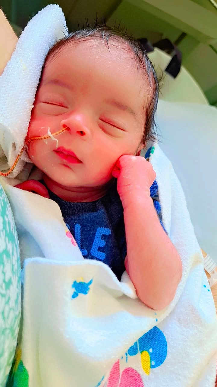 Montrond joined the competition — help win amazing prizes! newborn, baby, sleeping, blanket, infant, feeding_tube, face, hand, wrapped, cute, peaceful, indoors, person, skin, head, rest, closeup, healthcare, soft, toddler