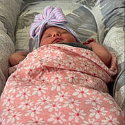 Sofia joined the competition — help win amazing prizes! newborn, baby, infant, sleeping, swaddled, blanket, floral_blanket, bow, headband, pink, cushion, chair, portrait, indoors, cozy, resting, face, closed_eyes, photography, child