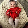 Willow is registered to the contest to win money with this photo: baby, blanket, clothing, coat, costume, couch, cushion, face, furniture, happy, hat, head, homedecor, hosiery, jacket, person, photography, portrait, smile, sock