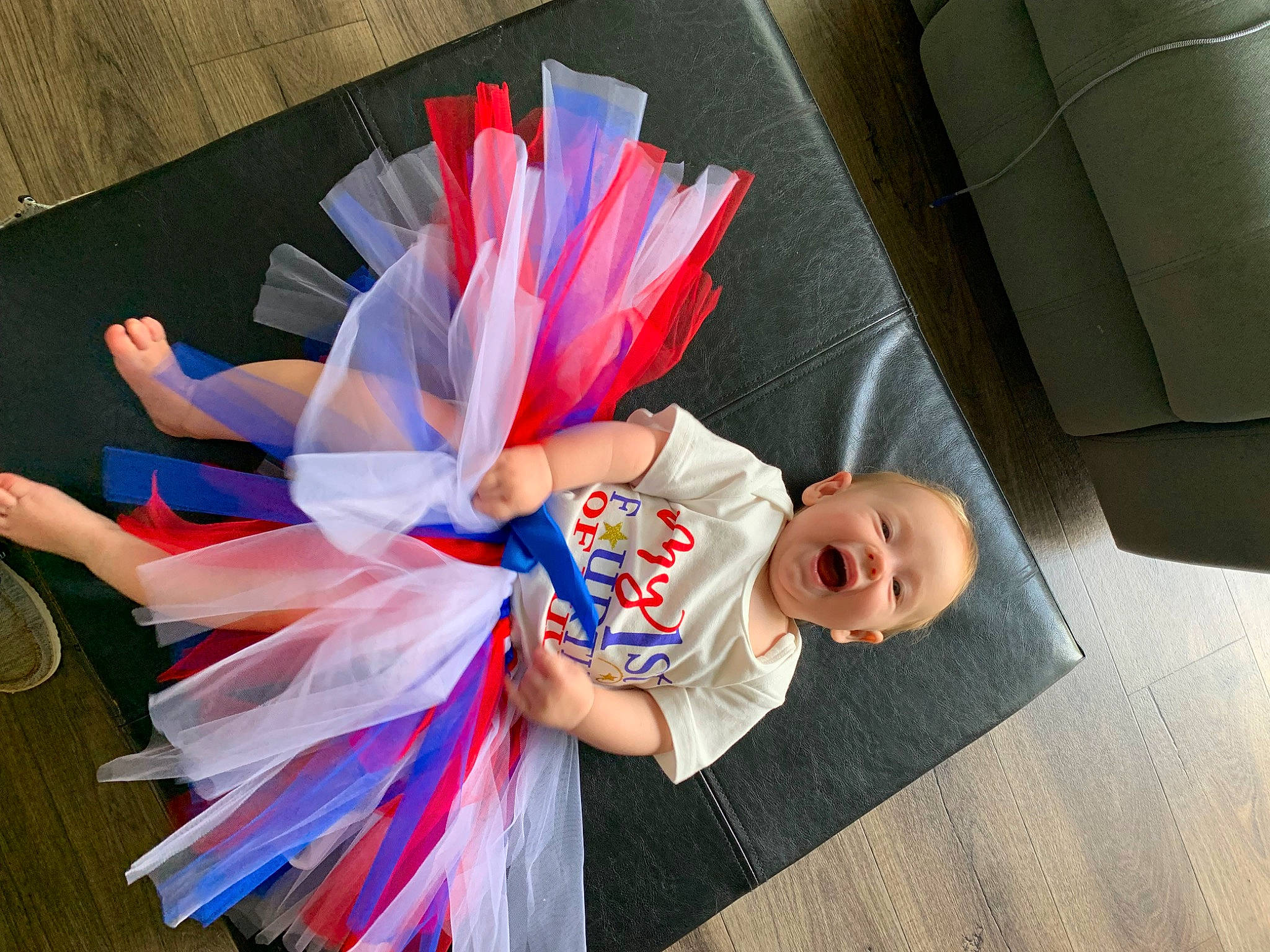 Zaelyn is registered to the contest to win money with this photo: automotive_wheel_system, baby, child, cosplay, costume, dress, electric_blue, event, fashion_accessory, flooring, fun, happy, hat, paper, party_supply, person, petal, recreation, room, toddler