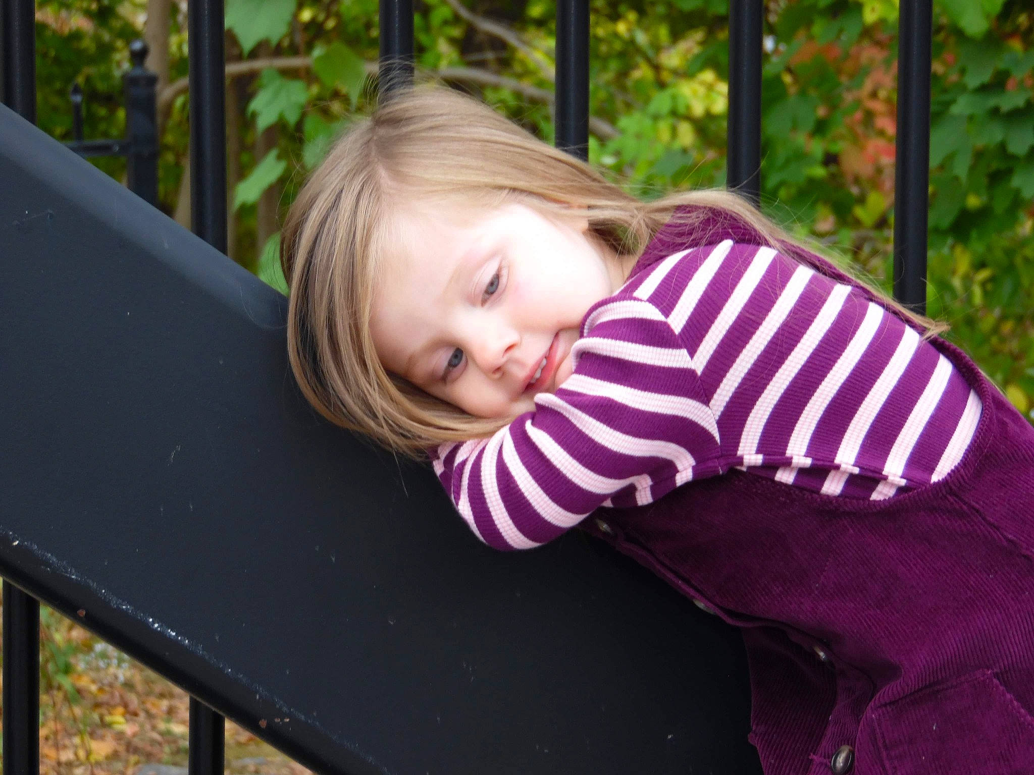 Evangeline joined the competition — help win amazing prizes! baby_toddler_clothing, blond, cheek, child, facial_expression, fun, grass, happy, leaf, leisure, magenta, mammal, outdoor_furniture, people_in_nature, person, sitting, sleeve, smile, spring, toddler