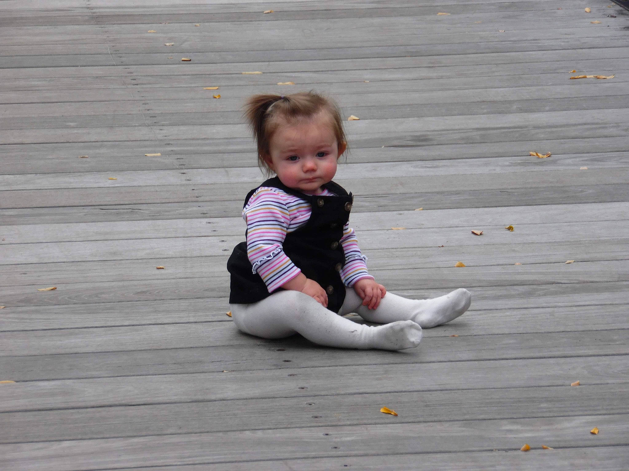 Catlynn joined the competition — help win amazing prizes! baby, baby_toddler_clothing, barefoot, child, deck, floor, flooring, foot, grass, grey, happy, hardwood, human_leg, leisure, person, sitting, t_shirt, thigh, toddler, wood