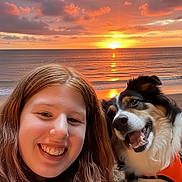 Sadie Cakes is registered to the contest to win money with this photo: woman, dog, beach, sunset, ocean, smiling, portrait, sand, outdoor, happy, pet, canine, nature, sky, clouds, water, friendship, leisure, vacation, sun