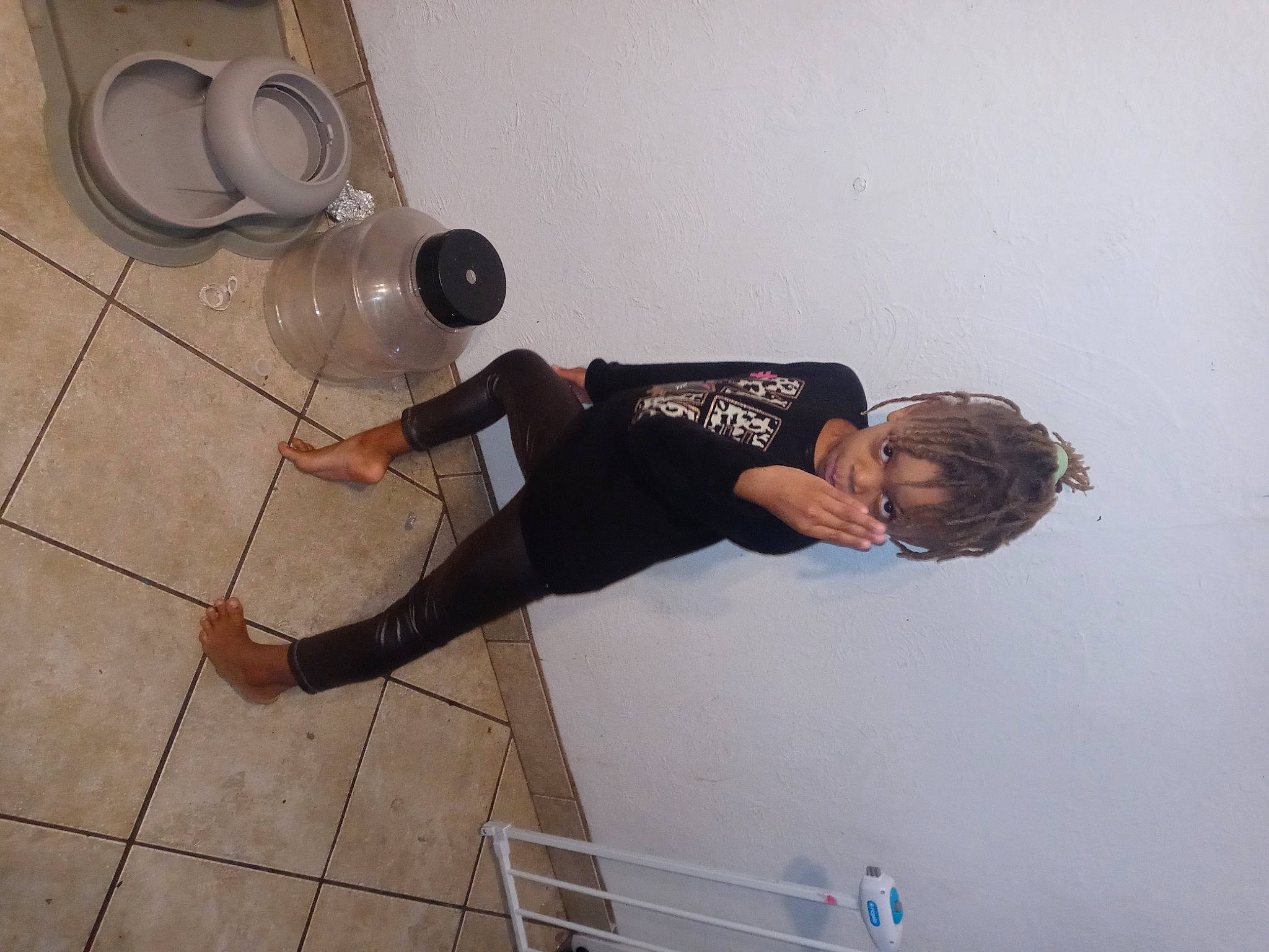 Mecca is registered to the contest to win money with this photo: audio_equipment, cleanliness, elbow, floor, flooring, fun, hardwood, human_leg, jeans, knee, leg, loudspeaker, mechanical_fan, person, shoe, sneakers, thigh, waist, walking_shoe, wood