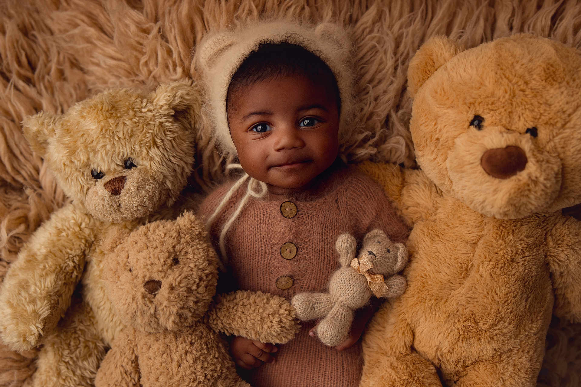 Karl joined the competition — help win amazing prizes! baby, child, teddy_bear, stuffed_animal, knitted_hat, knitted_sweater, plush, soft_texture, cute, portrait, smiling, indoor, cozy, warm_colors, fuzzy, toy, infant, happy, cuddly, face