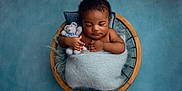 Karl is registered to the contest to win money with this photo: baby, sleeping, basket, blue_blanket, knitted_teddy, soft_texture, infant, peaceful, cozy, portrait, child, cute, newborn, wrapped, hand, closed_eyes, fuzzy, warm, homedecor, studio