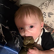 Cyrus joined the competition — help win amazing prizes! baby, bedding, biting, blanket, canteen, child, closeup, couch, cute, eyes, face, hair, hand, indoor, infant, pillow, portrait, skin, teething, toy