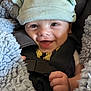 Cyrus is registered to the contest to win money with this photo: baby, blue_blanket, car_seat, child, clothing, cozy, cute, expression, face, hand, happy, hat, headwear, indoor, infant, portrait, seatbelt, smiling, warm, young_child