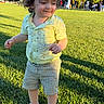Ayhan Sharifi joined the competition — help win amazing prizes! child, toddler, outdoor, park, grass, portrait, smiling, standing, playground, sunlight, summer, curly_hair, yellow_shirt, striped_shorts, colorful_shoes, lawn, family, recreation, daylight, happy