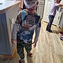 Noah Diekmann is registered to the contest to win money with this photo: boy, child, clothing, face, female, footwear, girl, hardwood, head, hosiery, indoors, interiordesign, kitchen, male, pants, person, plywood, shoe, sock, wood