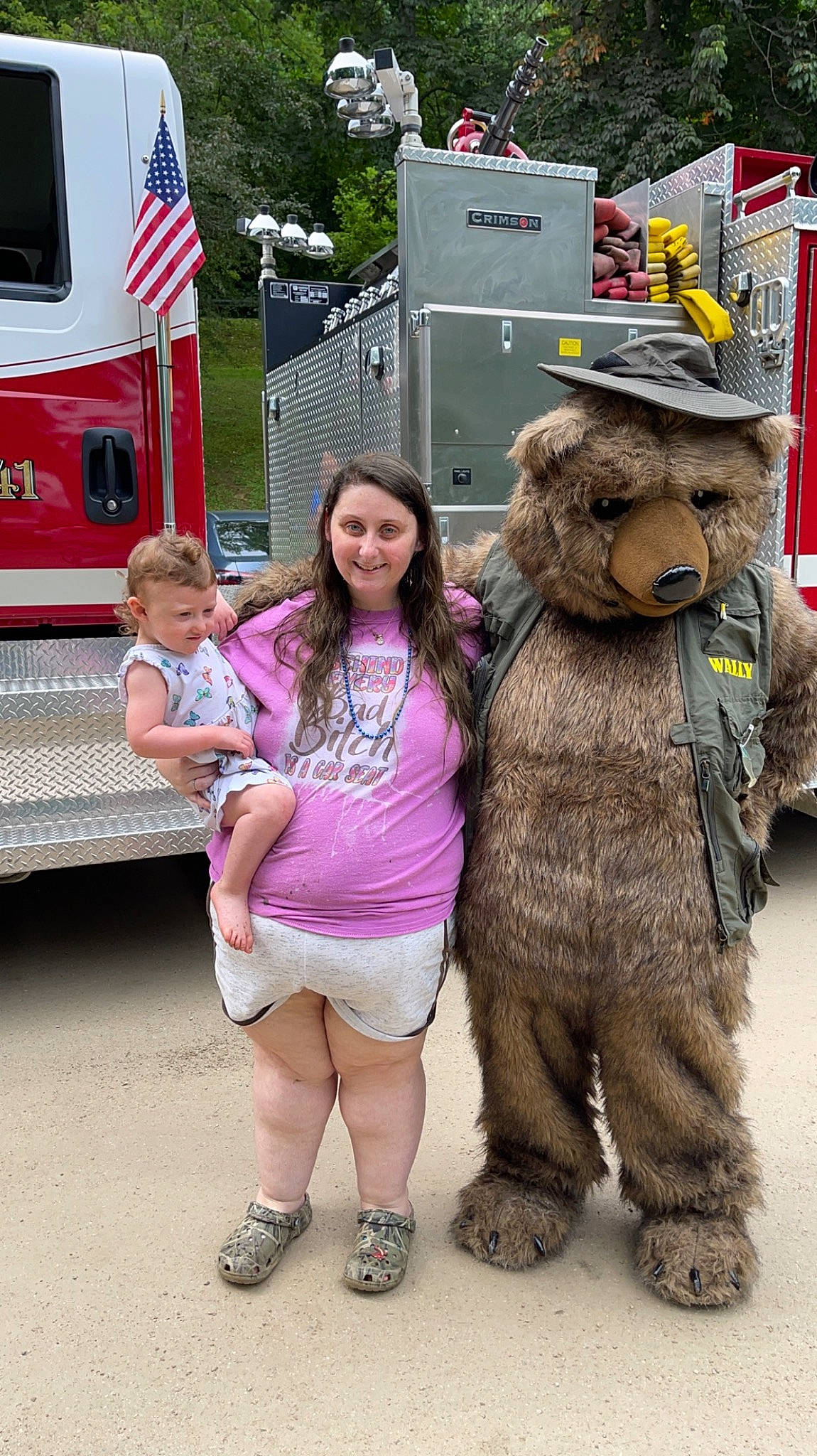 Brylee joined the competition — help win amazing prizes! auto_part, automotive_exterior, automotive_wheel_system, emergency_service, event, flag, flag_of_the_united_states, fun, fur, joy, mascot, motor_vehicle, person, pink, recreation, sandal, service, smile, street, toy