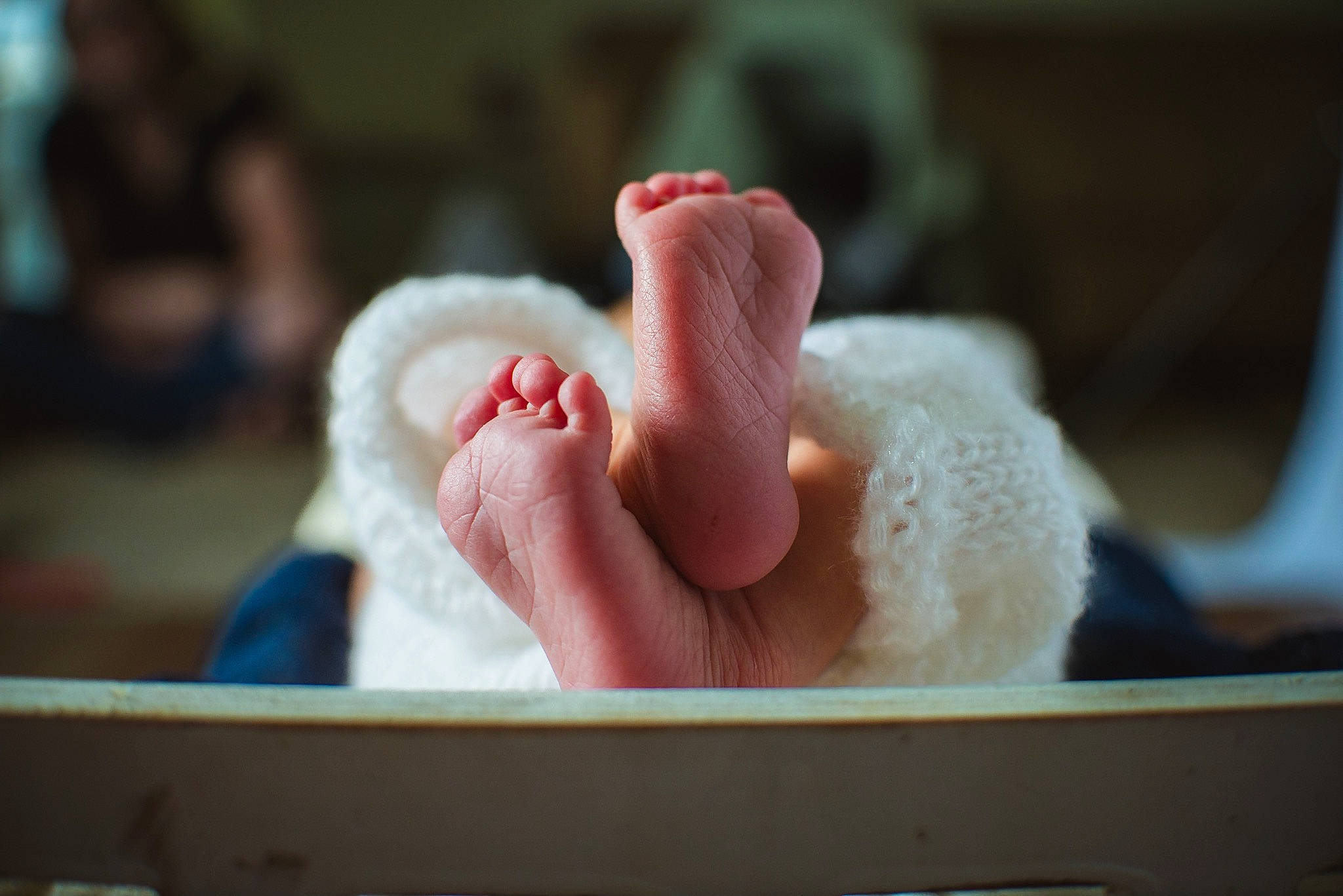 Mason is registered to the contest to win money with this photo: baby, child, comfort, flesh, foot, fur, gesture, human_leg, jaw, nail, person, thumb, under_exposed