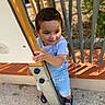 toddler, child, outdoor, playground, pole, blue_overalls, sandals, smile, curious, sunlight, shadows, greenery, metal, wood, person, young_child, casual_clothing, play, daylight, happy