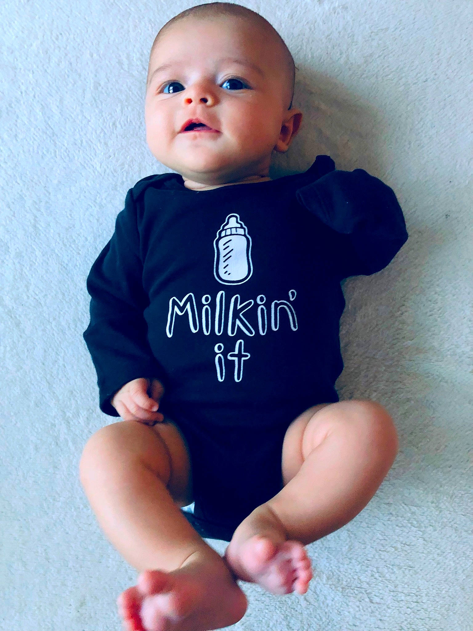 Gianna is registered to the contest to win money with this photo: baby, baby_toddler_clothing, cheek, electric_blue, face, finger, gesture, hand, happy, human_body, joint, neck, outerwear, person, photograph, skin, sleeve, t_shirt, thumb, toddler