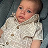 Aslan joined the competition — help win amazing prizes! baby, child, infant, blue_eyes, shirt, buttons, car_seat, cushion, bracelet, red_bracelet, gold_charm, patterned_shirt, curious_expression, closeup, portrait, casual_clothing, indoor, cute, young_child, comfortable