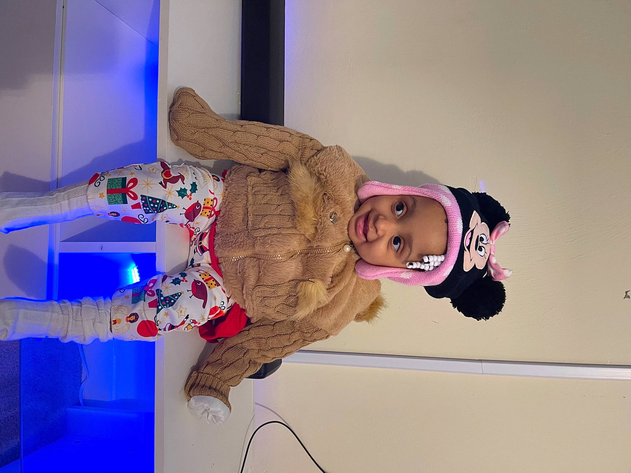 Storm Denise is registered to the contest to win money with this photo: baby_toddler_clothing, costume, fashion_design, fur, glove, hair_accessory, headband, headwear, joy, person, pink